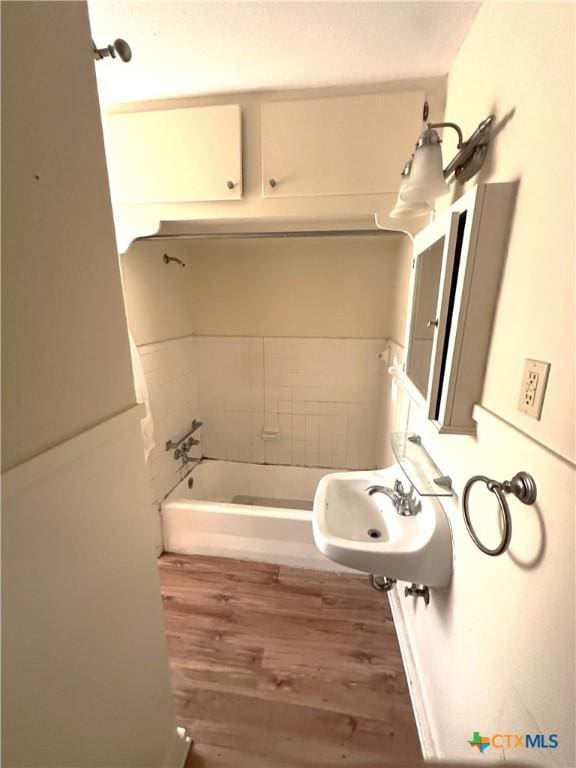 3703 Billy Dr, Victoria, TX 77901 - full bathroom with wood finished floors and a sink