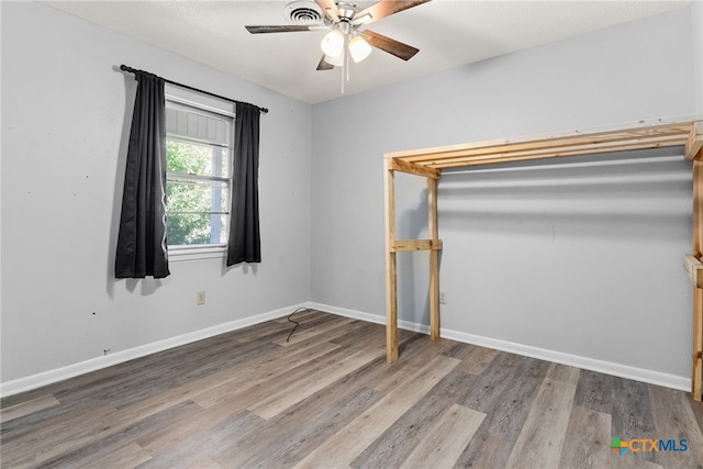 unfurnished bedroom featuring light hardwood / wood-style floors and ceiling fan