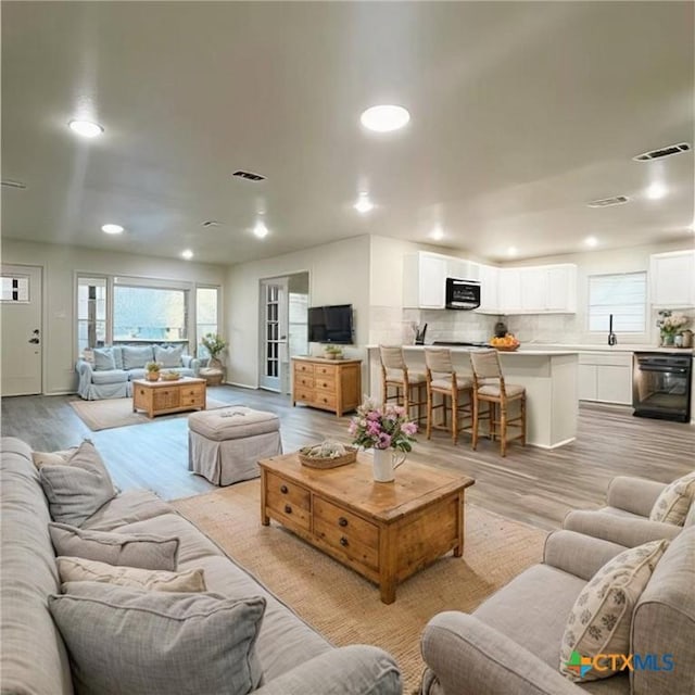 living room with light hardwood / wood-style floors