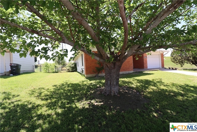 view of yard with a garage