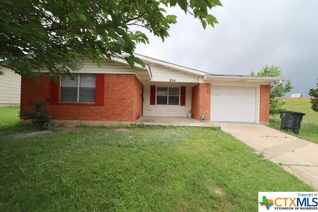 single story home with a garage and a front yard