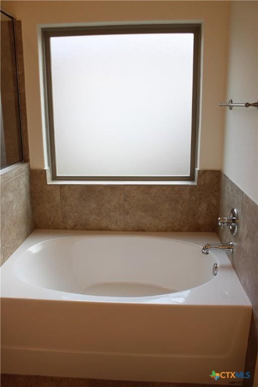 bathroom featuring a garden tub
