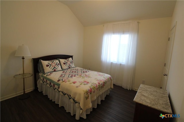 6108 Worthing Dr, Temple, TX 76502 - bedroom with dark wood-style flooring, lofted ceiling, and baseboards