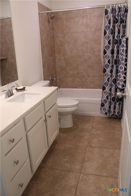 bathroom with shower / bath combination with curtain, toilet, tile patterned flooring, and vanity