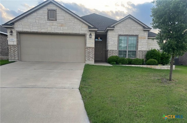 ranch-style home with a front lawn, driveway, a shingled roof, and an attached garage