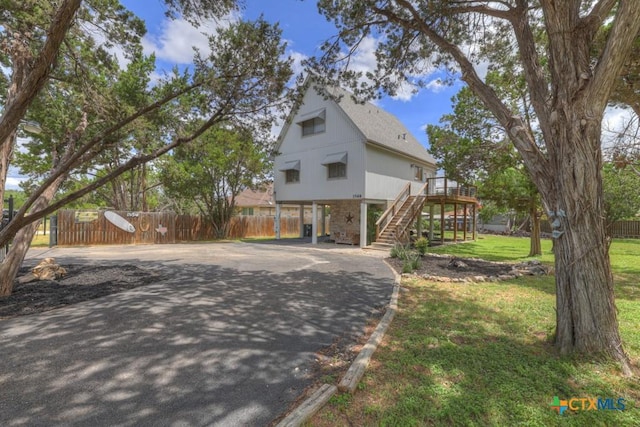 1568 Blueridge Dr, Canyon Lake, TX 78133 - view of front of property featuring driveway, a carport, stairway, and a wooden deck