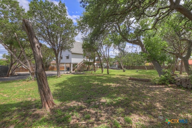 1568 Blueridge Dr, Canyon Lake, TX 78133 - fenced backyard featuring stairway