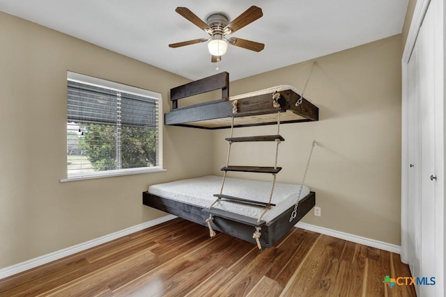 1568 Blueridge Dr, Canyon Lake, TX 78133 - bedroom featuring wood finished floors and ceiling fan