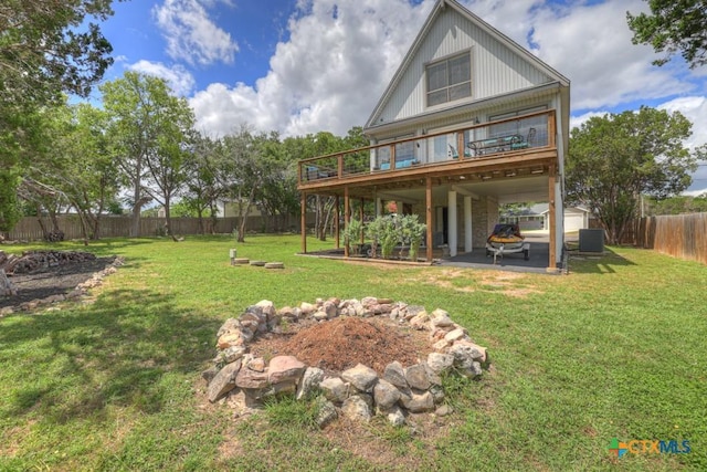 1568 Blueridge Dr, Canyon Lake, TX 78133 - back of house featuring a fenced backyard, a deck, a patio, and a storage shed