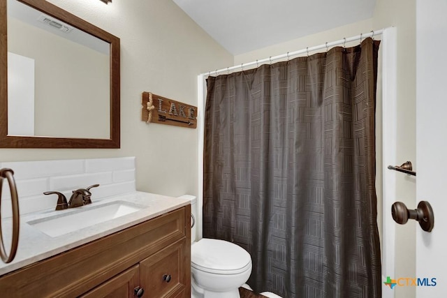 1568 Blueridge Dr, Canyon Lake, TX 78133 - full bathroom with vanity, tasteful backsplash, and curtained shower