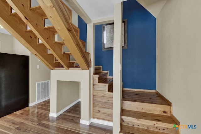 1568 Blueridge Dr, Canyon Lake, TX 78133 - stairway with wood finished floors and baseboards