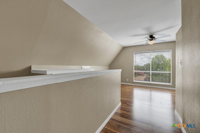 1568 Blueridge Dr, Canyon Lake, TX 78133 - hallway featuring wood finished floors, a textured wall, and lofted ceiling