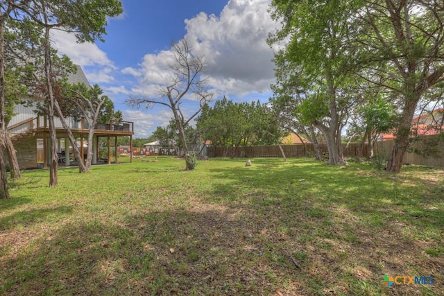 1568 Blueridge Dr, Canyon Lake, TX 78133 - fenced backyard with a wooden deck and stairs