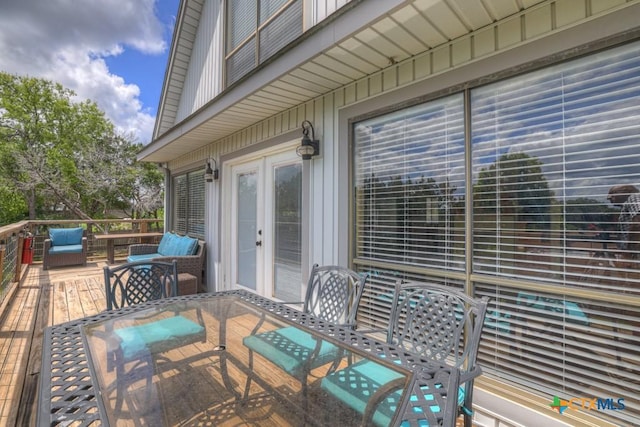 1568 Blueridge Dr, Canyon Lake, TX 78133 - view of patio / terrace featuring outdoor dining area, a deck, and french doors