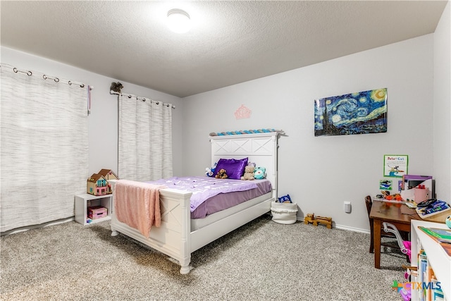 bedroom featuring carpet floors and a textured ceiling