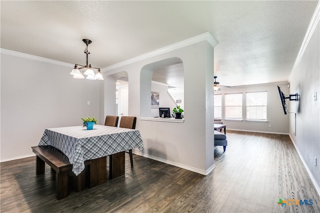 dining room with ceiling fan, a textured ceiling, dark hardwood / wood-style flooring, and ornamental molding