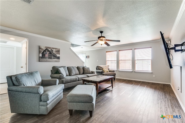 living room with a textured ceiling, dark hardwood / wood-style floors, ceiling fan, and crown molding