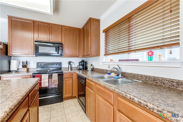 kitchen featuring ornamental molding, black appliances, sink, and light tile patterned floors