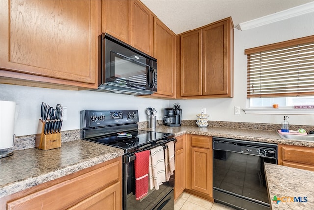 kitchen featuring black appliances, a textured ceiling, light tile patterned floors, and crown molding