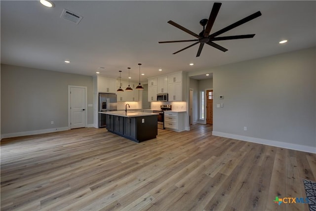 701 S Hudson St, Flatonia, TX 78941 - kitchen featuring stainless steel appliances, open floor plan, a sink, a ceiling fan, and recessed lighting