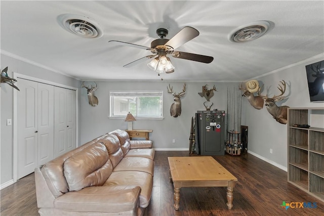 living area with visible vents, a ceiling fan, and crown molding