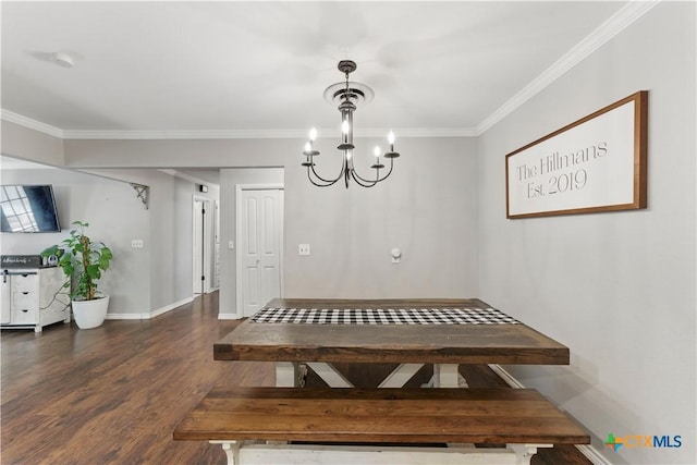 dining room with crown molding, a chandelier, baseboards, dark wood-type flooring, and visible vents