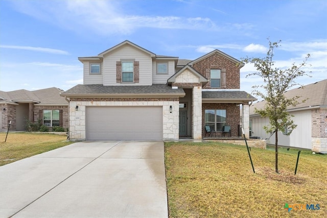 view of front of home featuring a garage and a front lawn