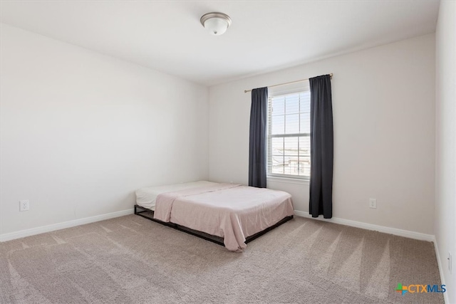 unfurnished bedroom with light colored carpet