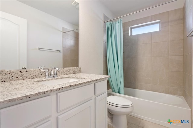 full bathroom featuring vanity, tile patterned flooring, shower / bath combo, and toilet