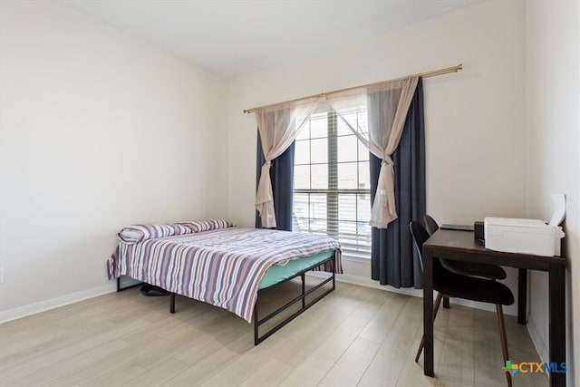 bedroom with light hardwood / wood-style flooring