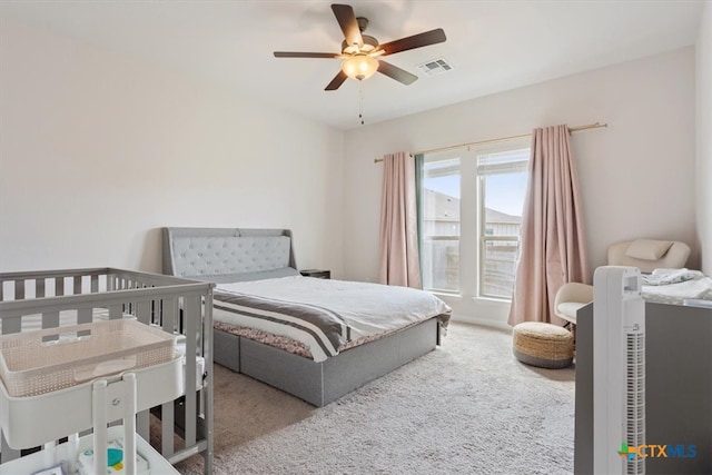 carpeted bedroom with ceiling fan