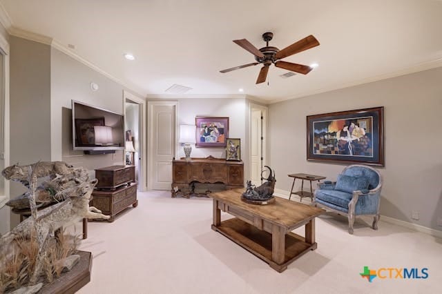 living room featuring ornamental molding, light carpet, and ceiling fan