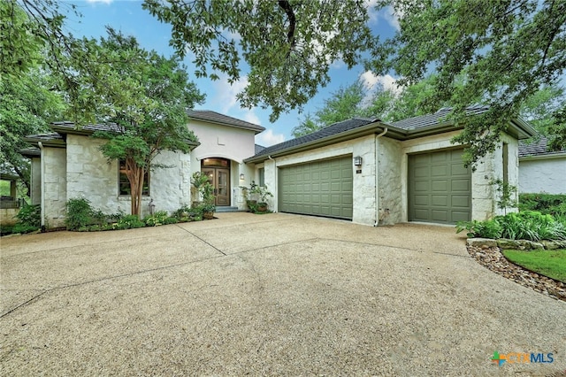 view of front of property with a garage