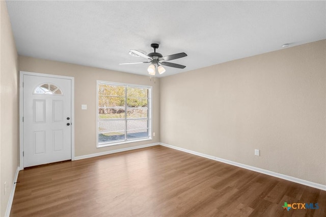 entrance foyer with hardwood / wood-style flooring and ceiling fan