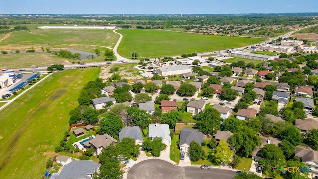 aerial view of property's location with nearby suburban area