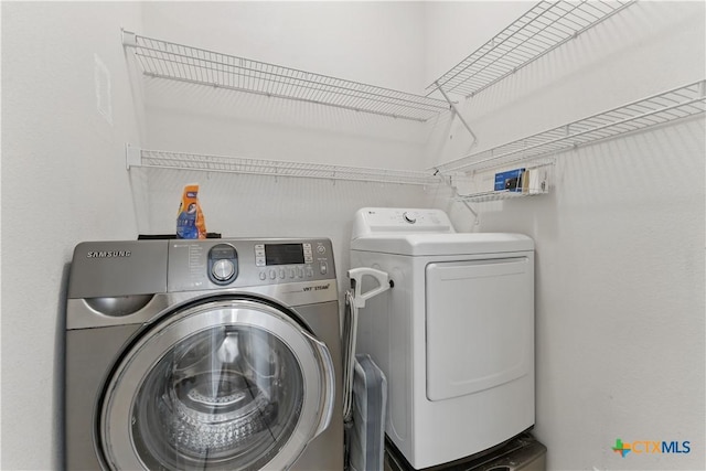 washroom featuring independent washer and dryer