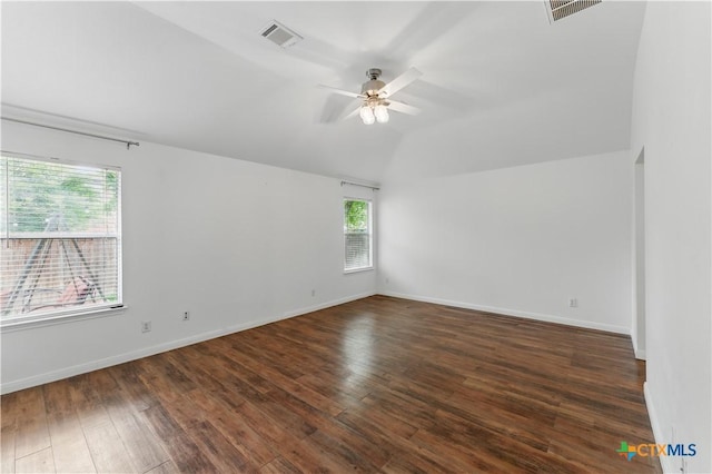 empty room featuring lofted ceiling, a ceiling fan, wood finished floors, and baseboards
