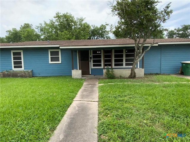 1705 E Poplar Ave, Victoria, TX 77901 - view of front of home featuring a front lawn