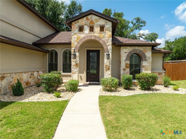 1010 Woodland Bend Cir, Salado, TX 76571 - property entrance featuring stone siding, stucco siding, and roof with shingles