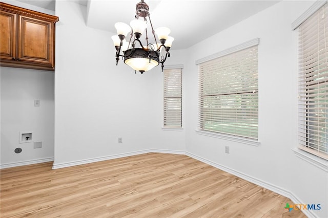 1010 Woodland Bend Cir, Salado, TX 76571 - unfurnished dining area with a chandelier and light wood finished floors