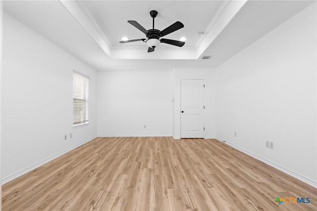 1010 Woodland Bend Cir, Salado, TX 76571 - unfurnished room featuring a raised ceiling, crown molding, light wood-style flooring, recessed lighting, and a ceiling fan