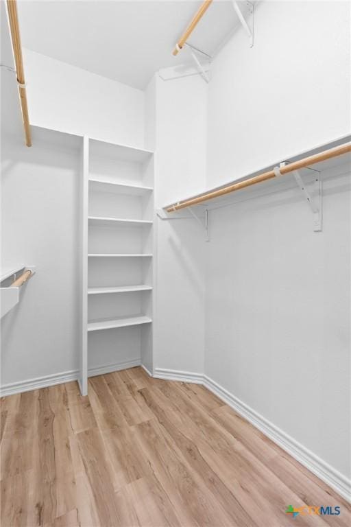 1010 Woodland Bend Cir, Salado, TX 76571 - walk in closet with wood finished floors