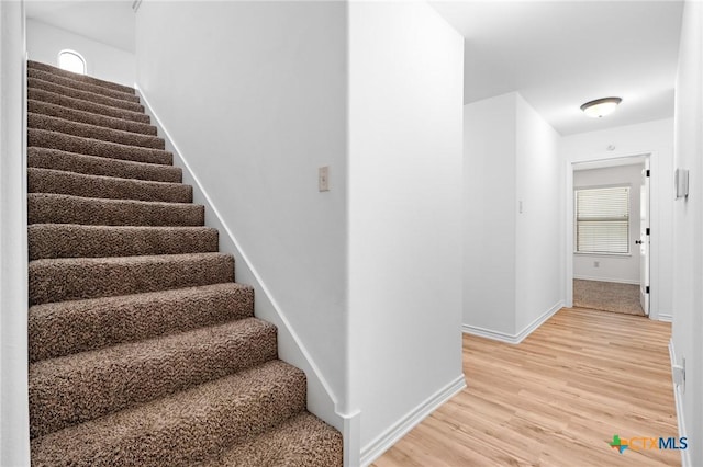 1010 Woodland Bend Cir, Salado, TX 76571 - stairs with baseboards and wood finished floors