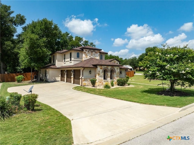 1010 Woodland Bend Cir, Salado, TX 76571 - mediterranean / spanish-style home featuring stone siding, concrete driveway, a garage, and stucco siding