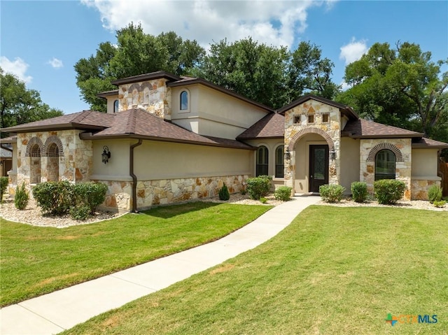 1010 Woodland Bend Cir, Salado, TX 76571 - view of front facade with stone siding, stucco siding, a front lawn, and a shingled roof