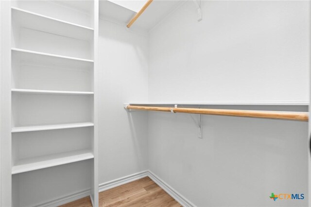 1010 Woodland Bend Cir, Salado, TX 76571 - spacious closet with wood finished floors