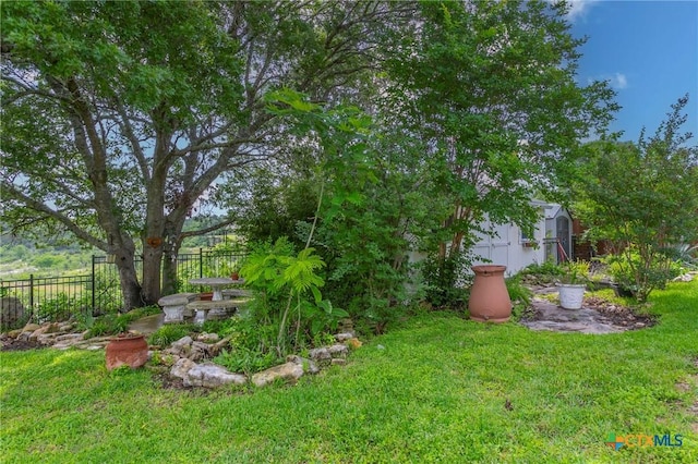 522 Woodland Point Rd, Belton, TX 76513 - view of yard featuring fence, an outbuilding, and a storage unit