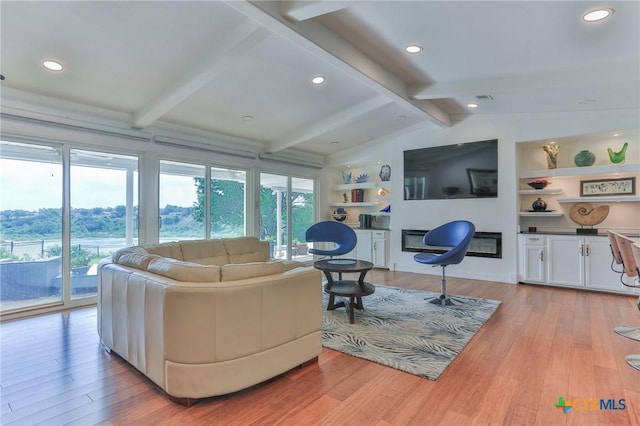 522 Woodland Point Rd, Belton, TX 76513 - living area with recessed lighting, lofted ceiling with beams, a glass covered fireplace, and light wood-type flooring