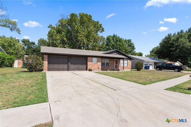 single story home featuring a garage and a front yard