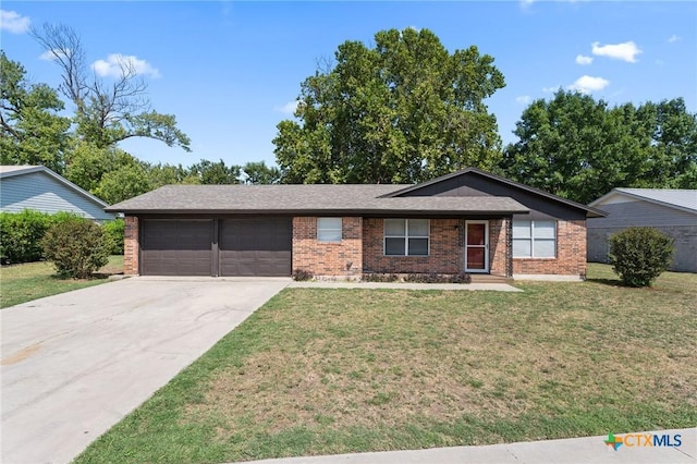 single story home featuring a garage and a front yard